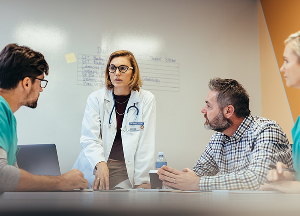Meeting with a doctor in a lab coat